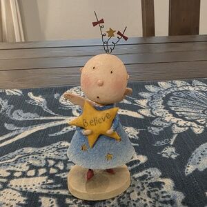 Whimsical Blue Figurine with Star